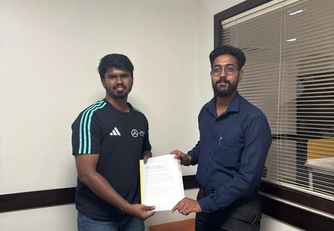 Kaushik Raju with a student holding an offer letter